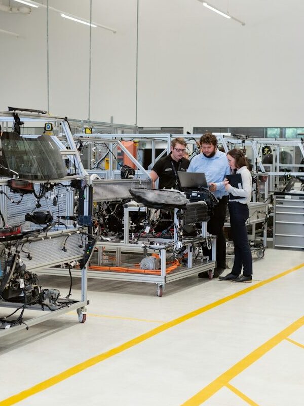 engineers working in automotive factory