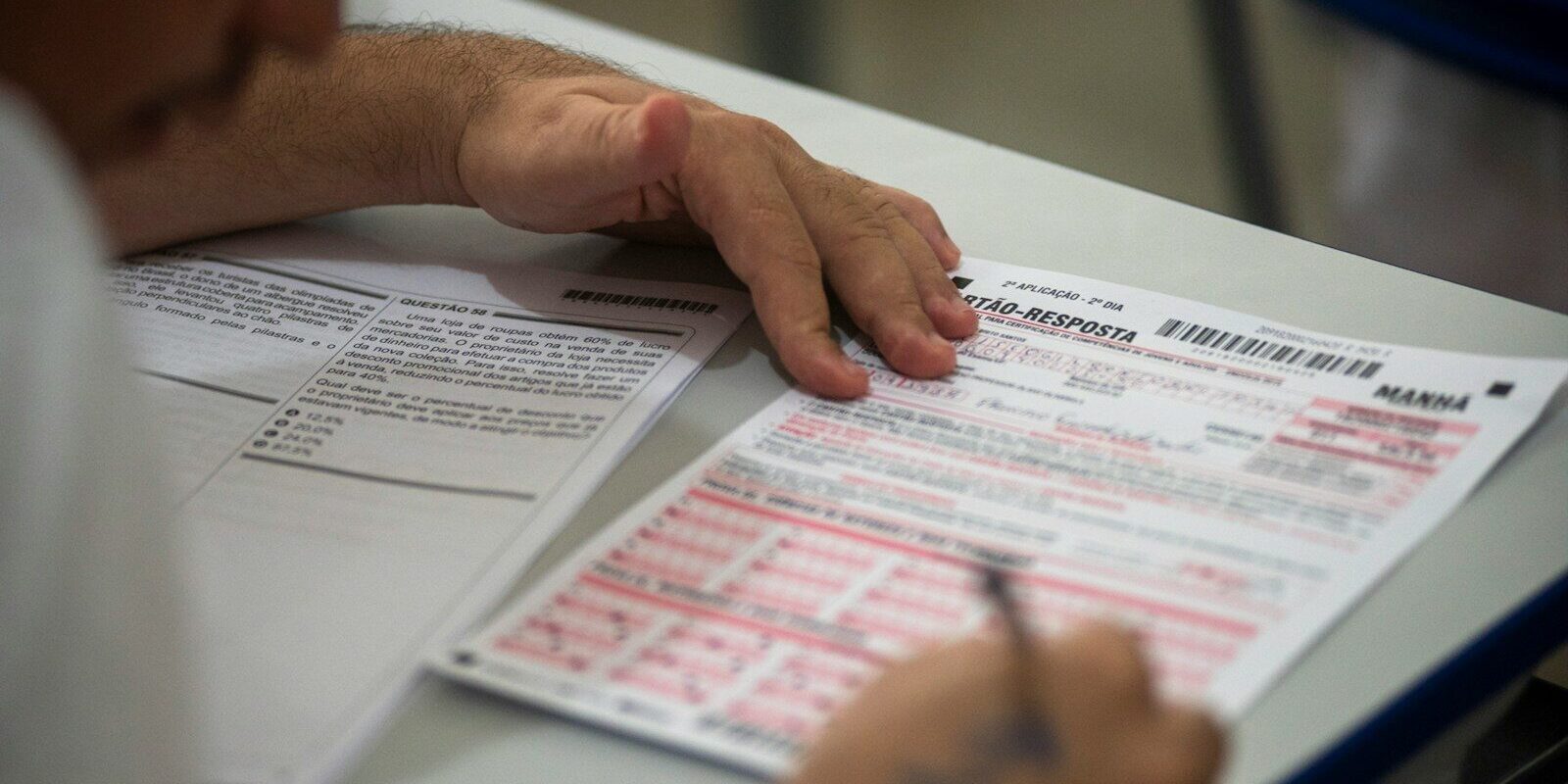 person filling on application form