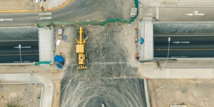 Aerial shot of road construction site in Lima, showcasing infrastructure development in Peru.