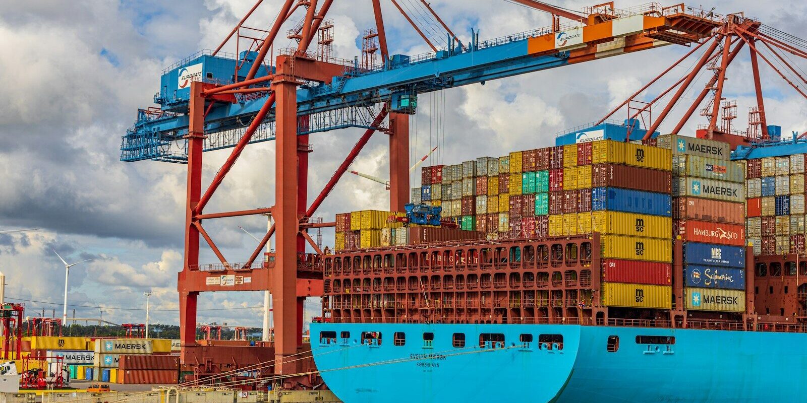 blue and red cargo ship