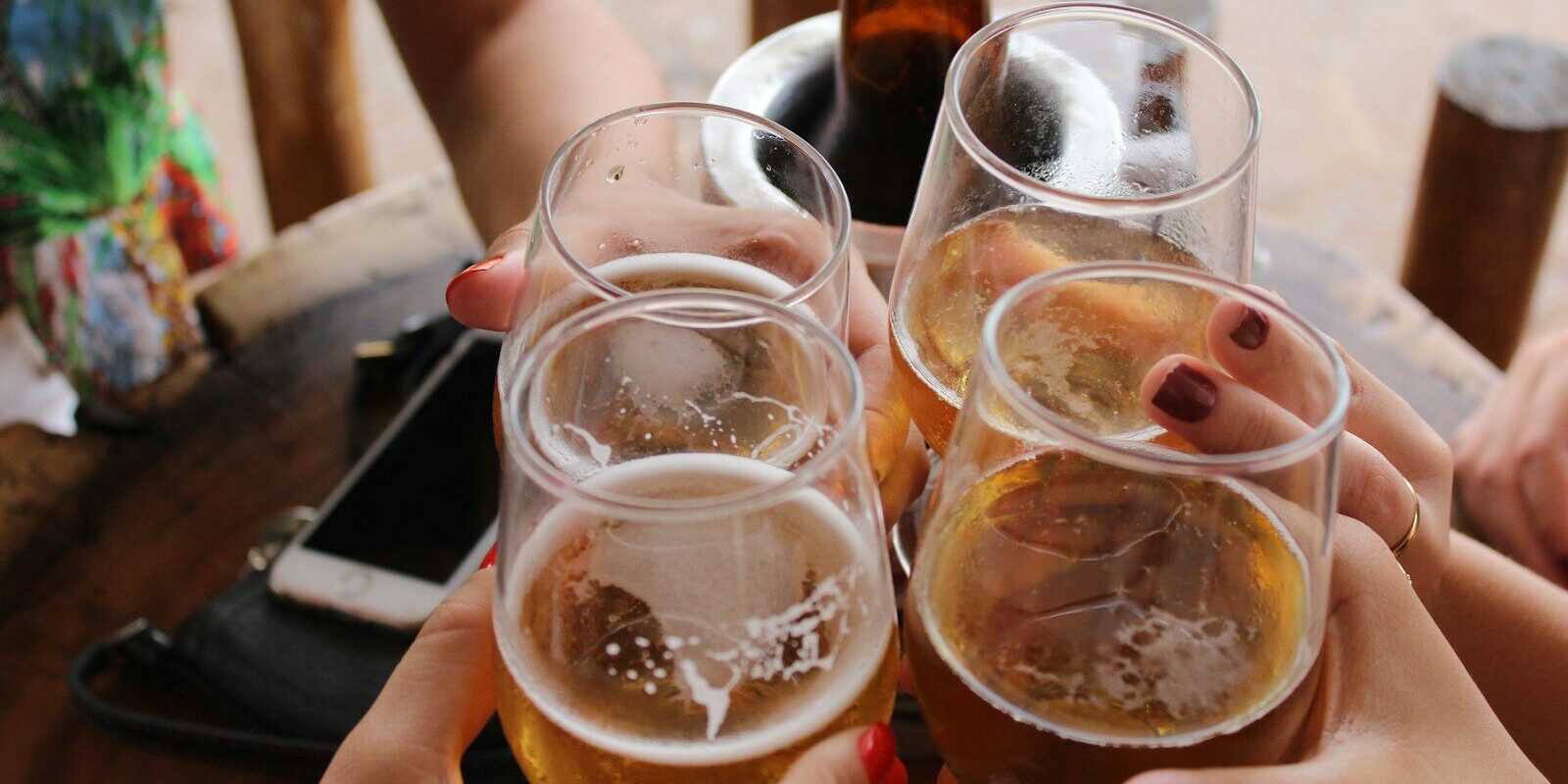 four clear stemless glasses