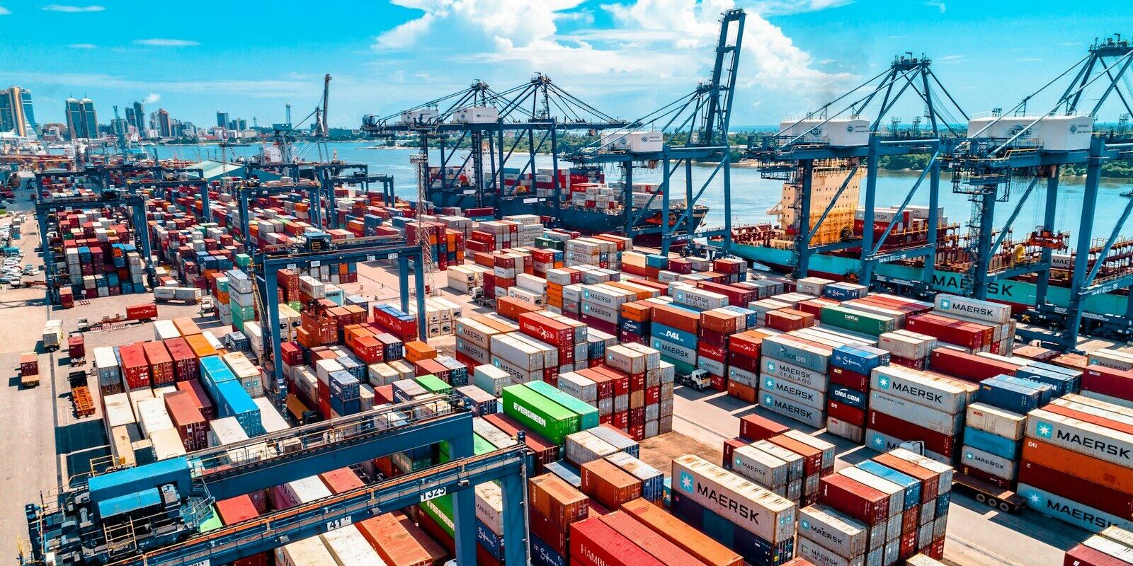Photo by Ali Mkumbwa a large amount of containers are stacked on top of each other
