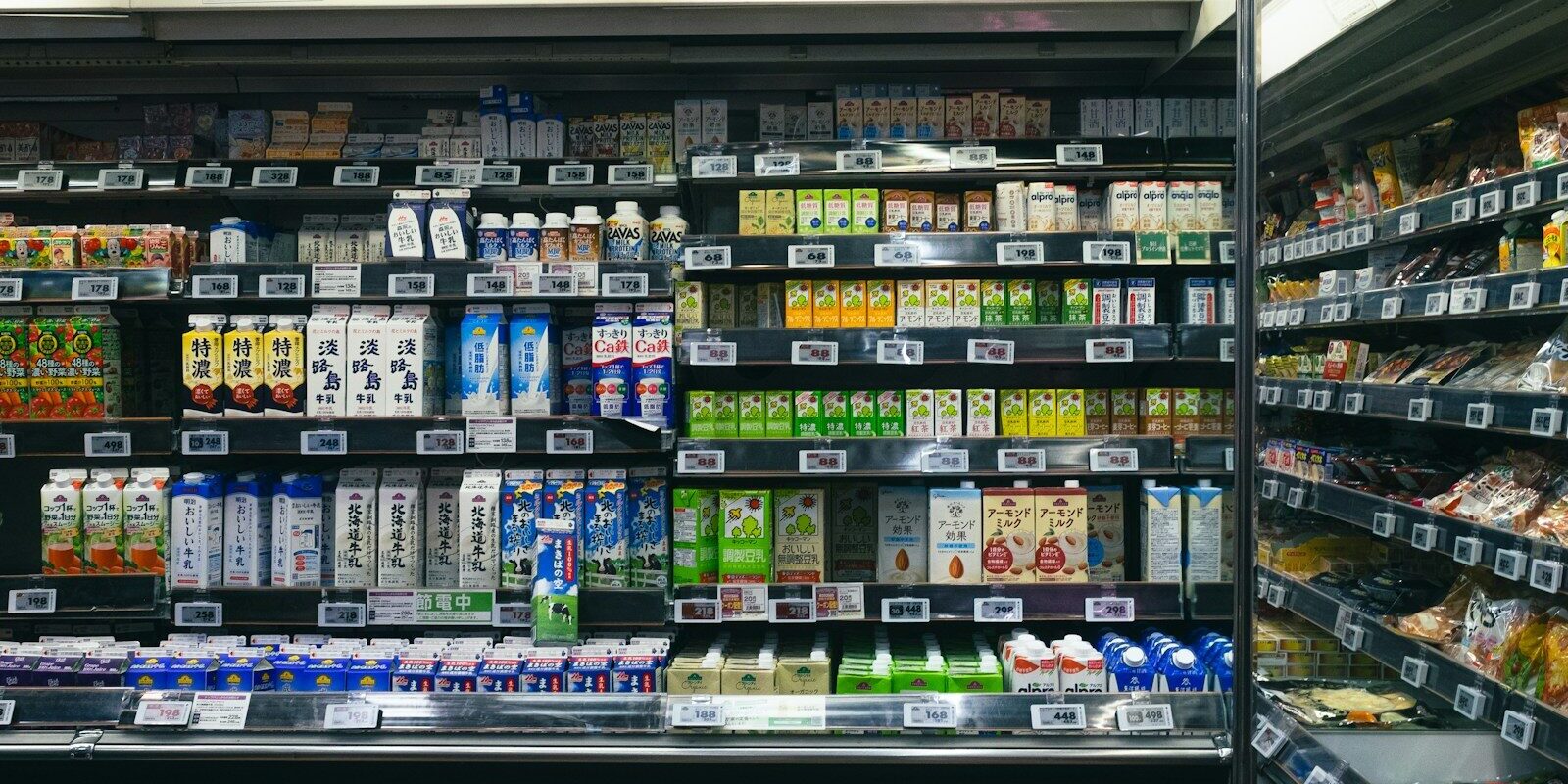 Shelves stocked with beverages and food items in a store