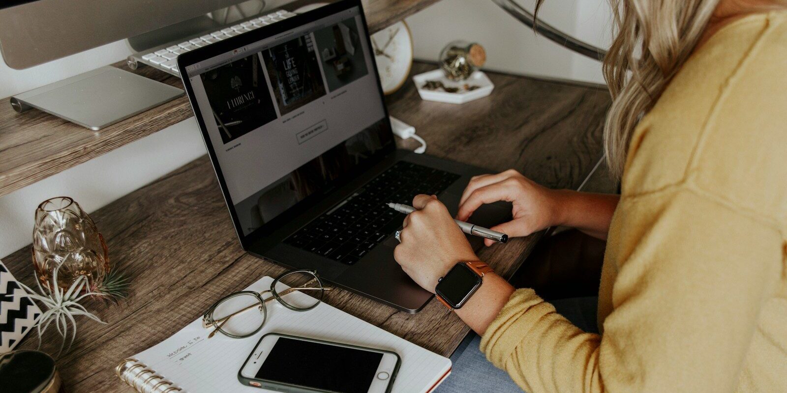 Photo by Corinne Kutz person in blue denim jeans using macbook pro