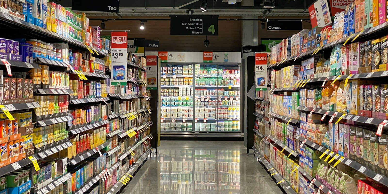 grocery store aisle with stocked shelves