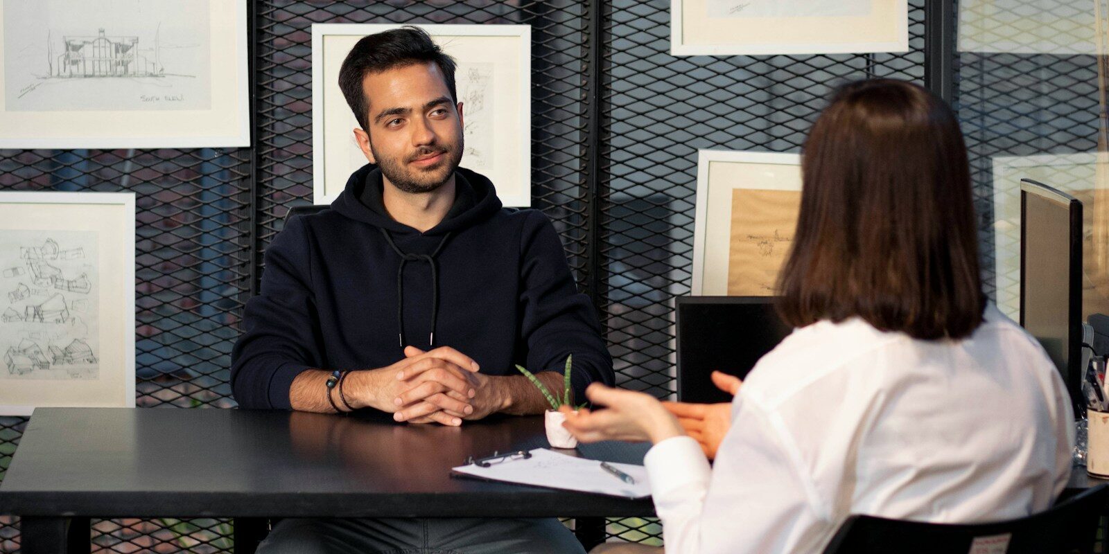 a man and a woman sitting at a table