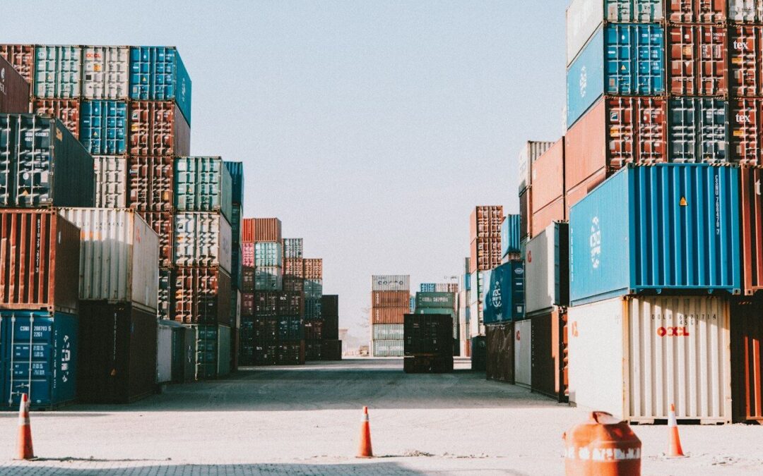 a large amount of containers are stacked on top of each other