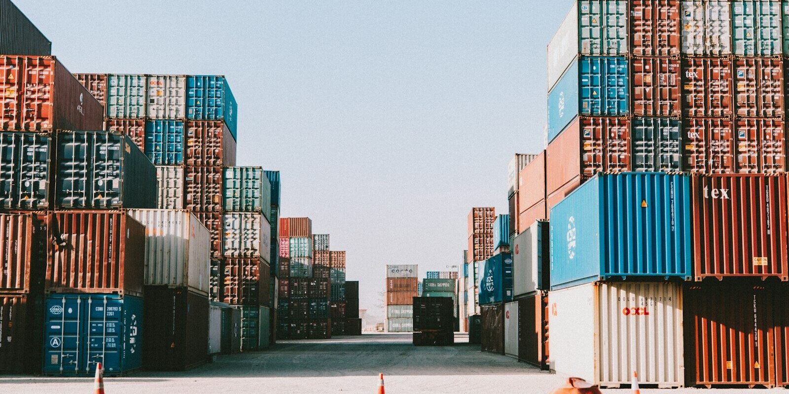 a large amount of containers are stacked on top of each other