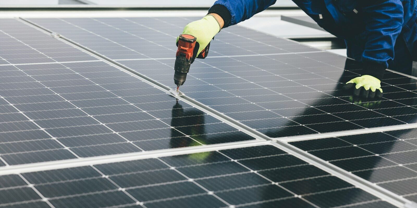 a person working on a solar panel
