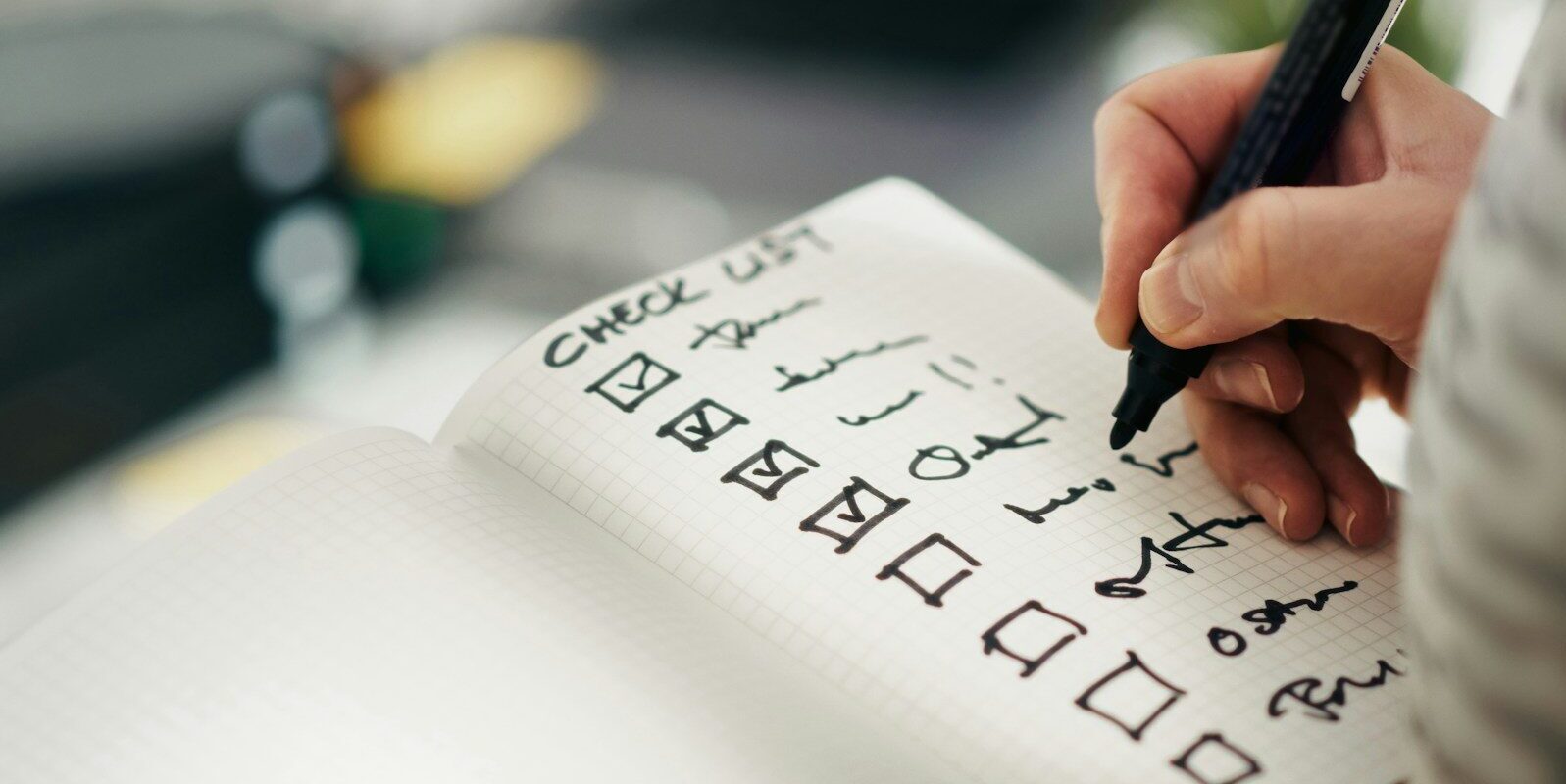 Someone is checking items off a checklist