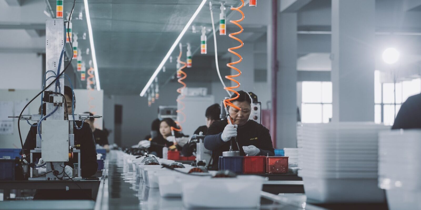 a group of people working in a factory